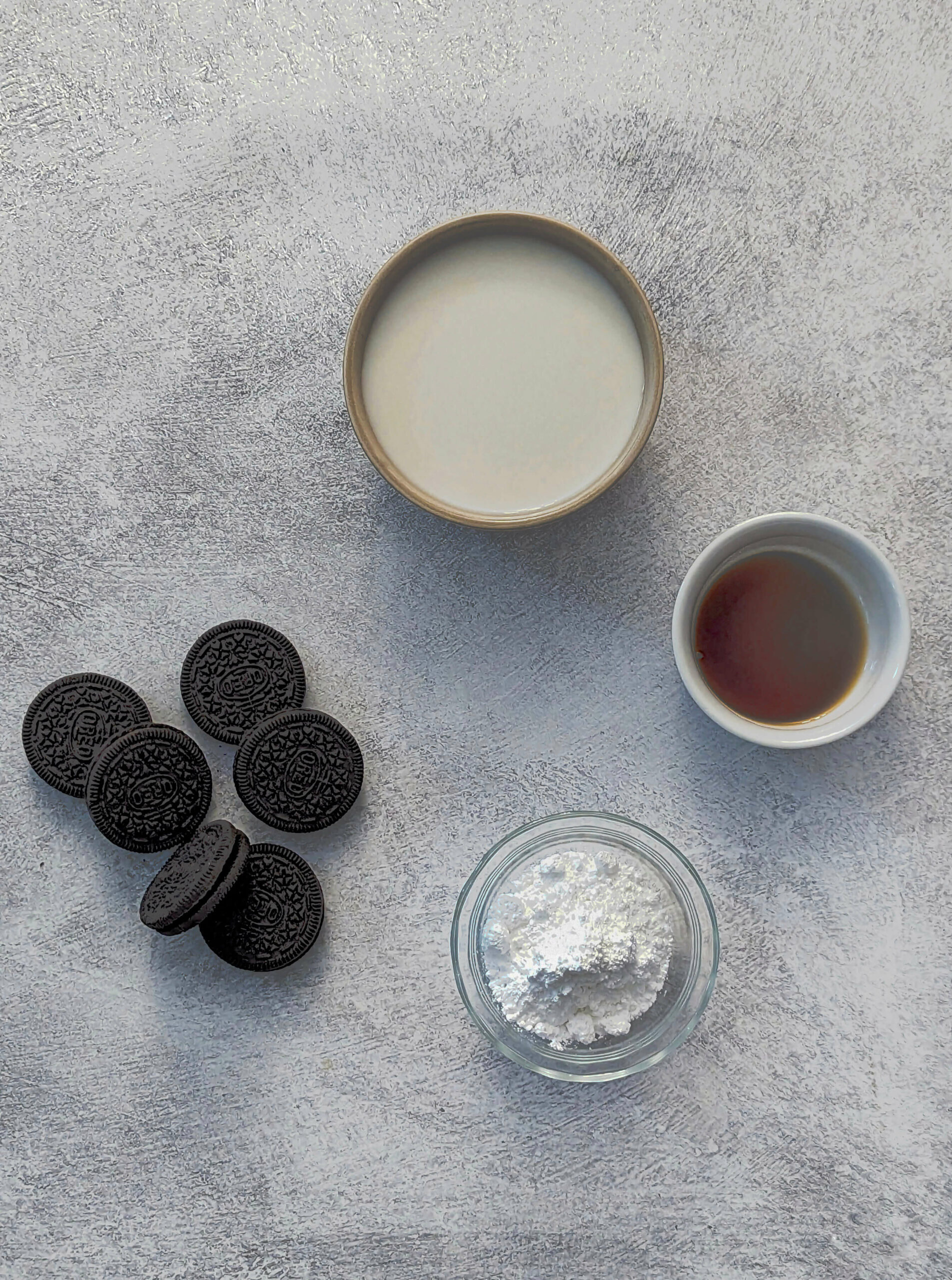 An image showing all of the ingredients for Oreo Milkshake without Ice Cream.