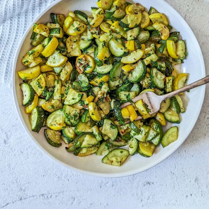 Air fryer zucchini and squash in a serving bowl.