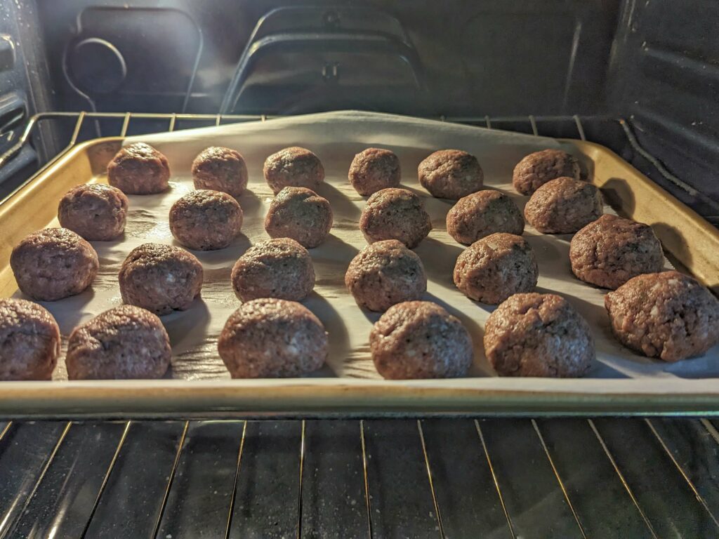 Meatballs baking at 350 in the oven.