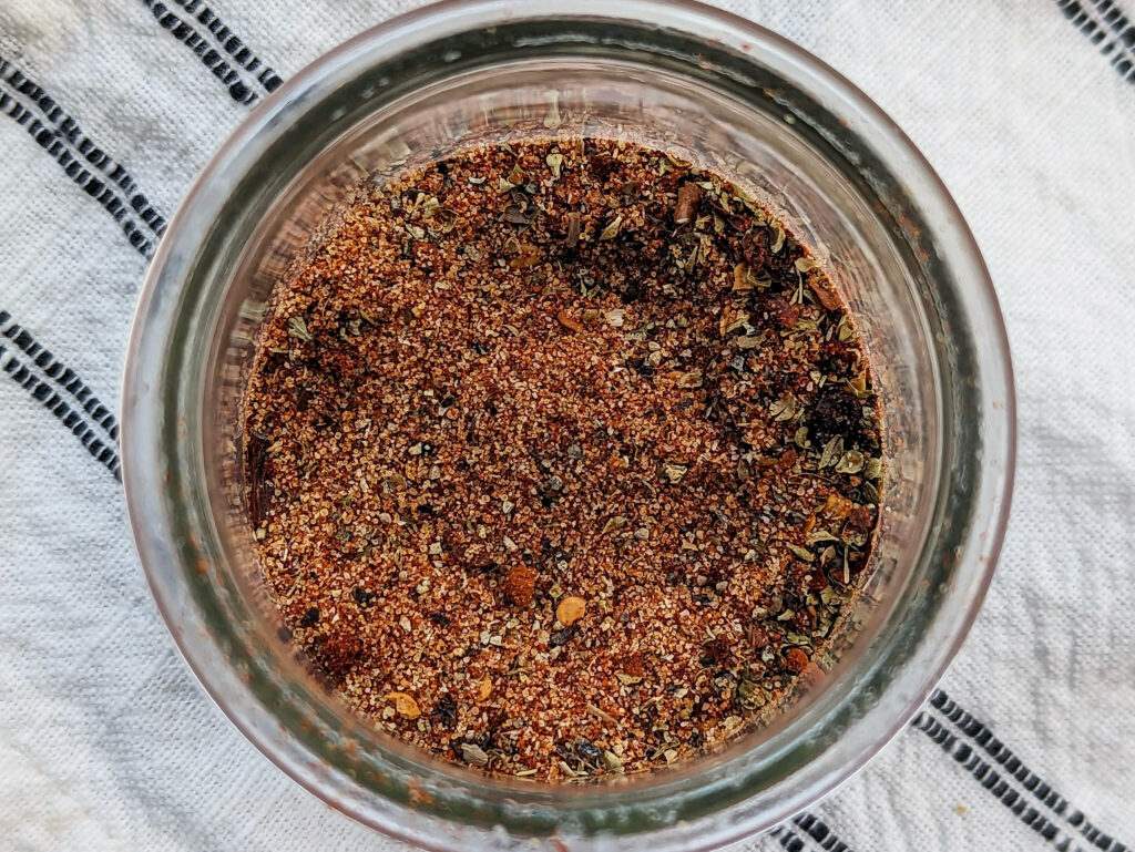 A close up of a jar of our homemade Slap Ya Mama Seasoning Recipe.