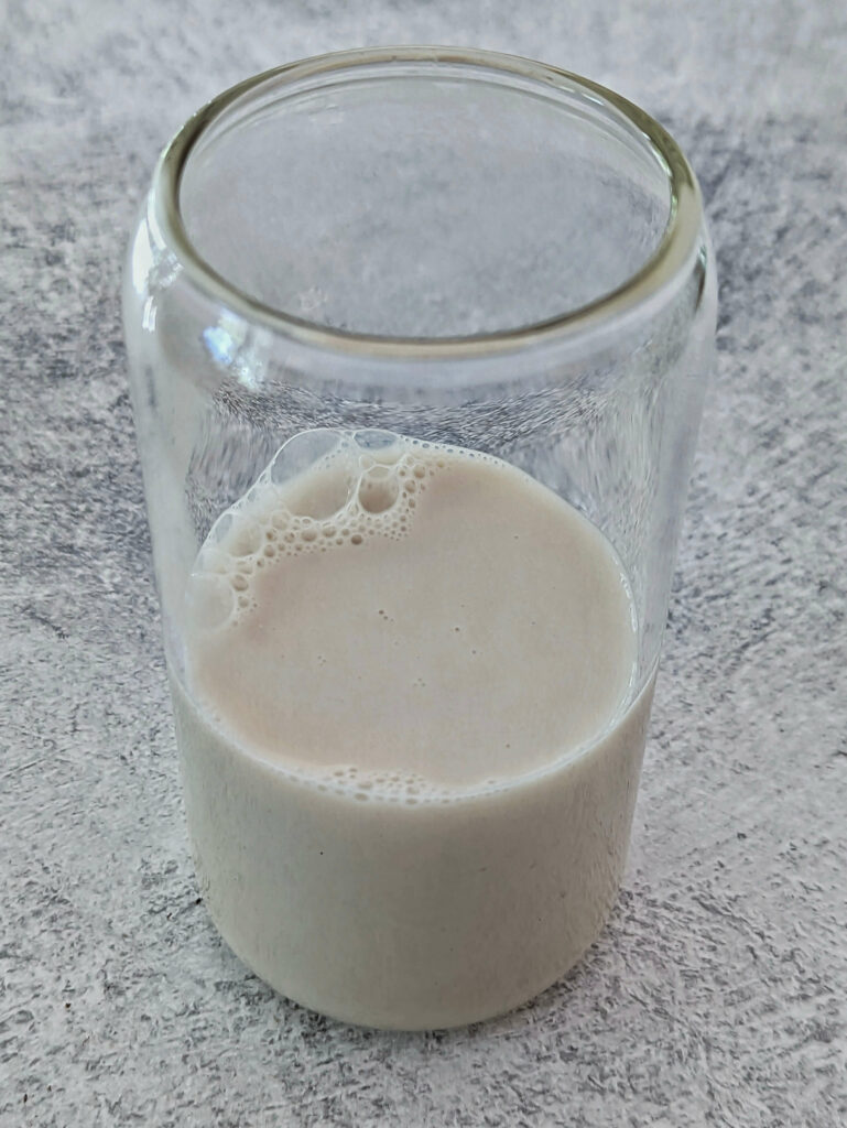 Milk added to the bottom of a drinking glass.