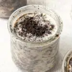 A close up of a small container of oreo overnight oats.