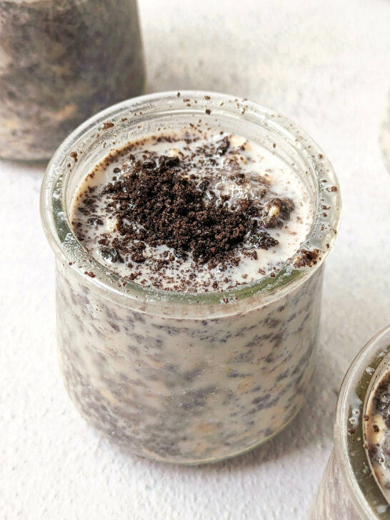 A close up of a small container of oreo overnight oats.