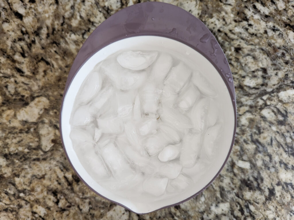 Cooked eggs in an ice bath.