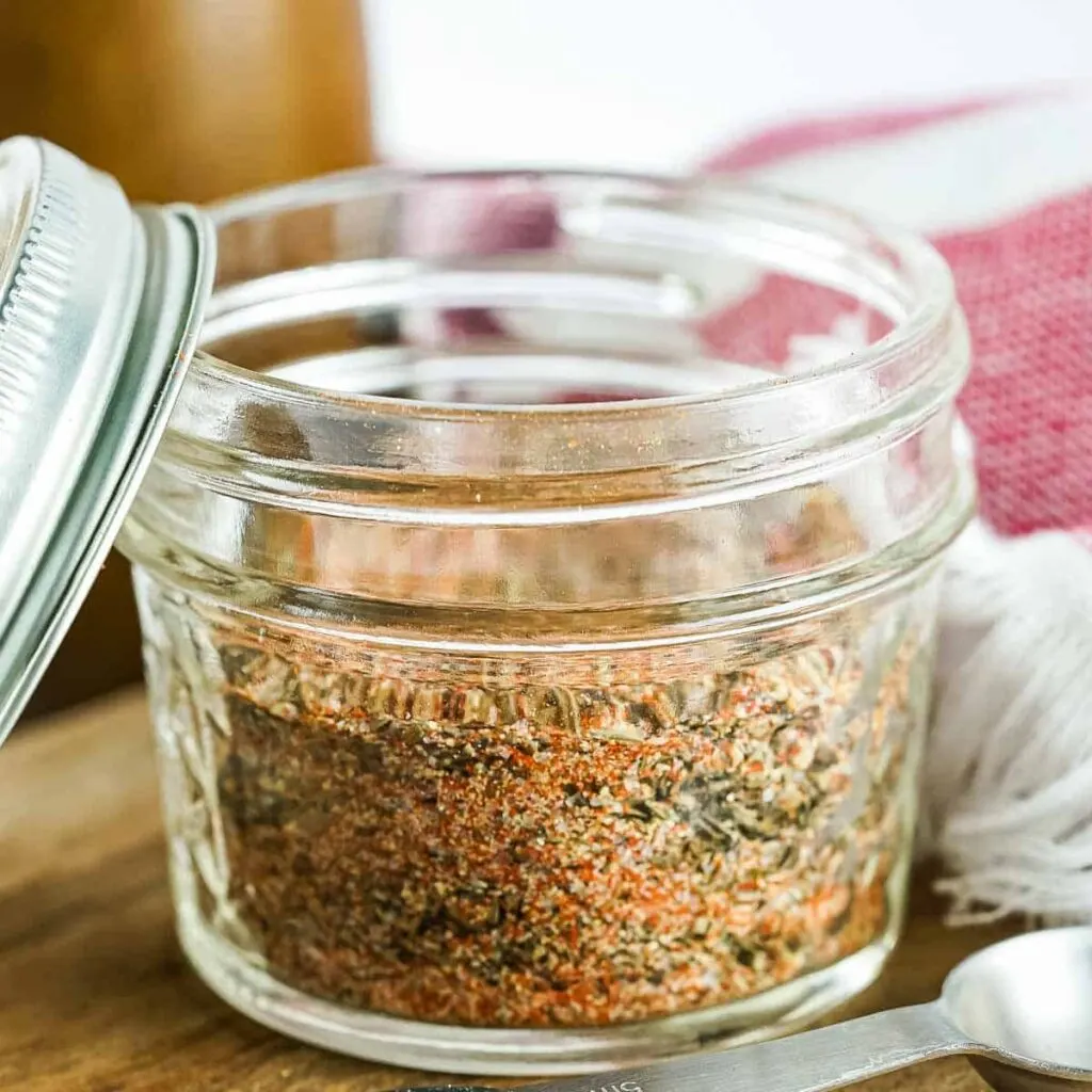 A small container of steak seasoning.