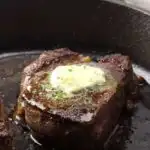 A steak fillet topped with compound butter.