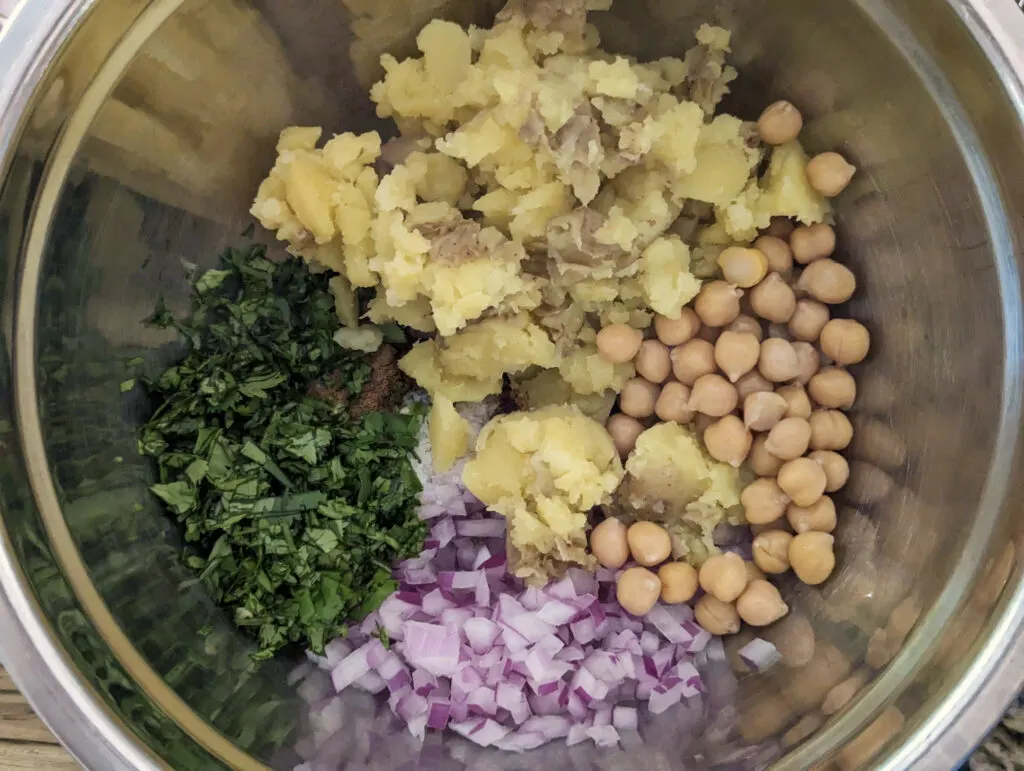 The ingredients for the potato chickpea filling in a bowl.