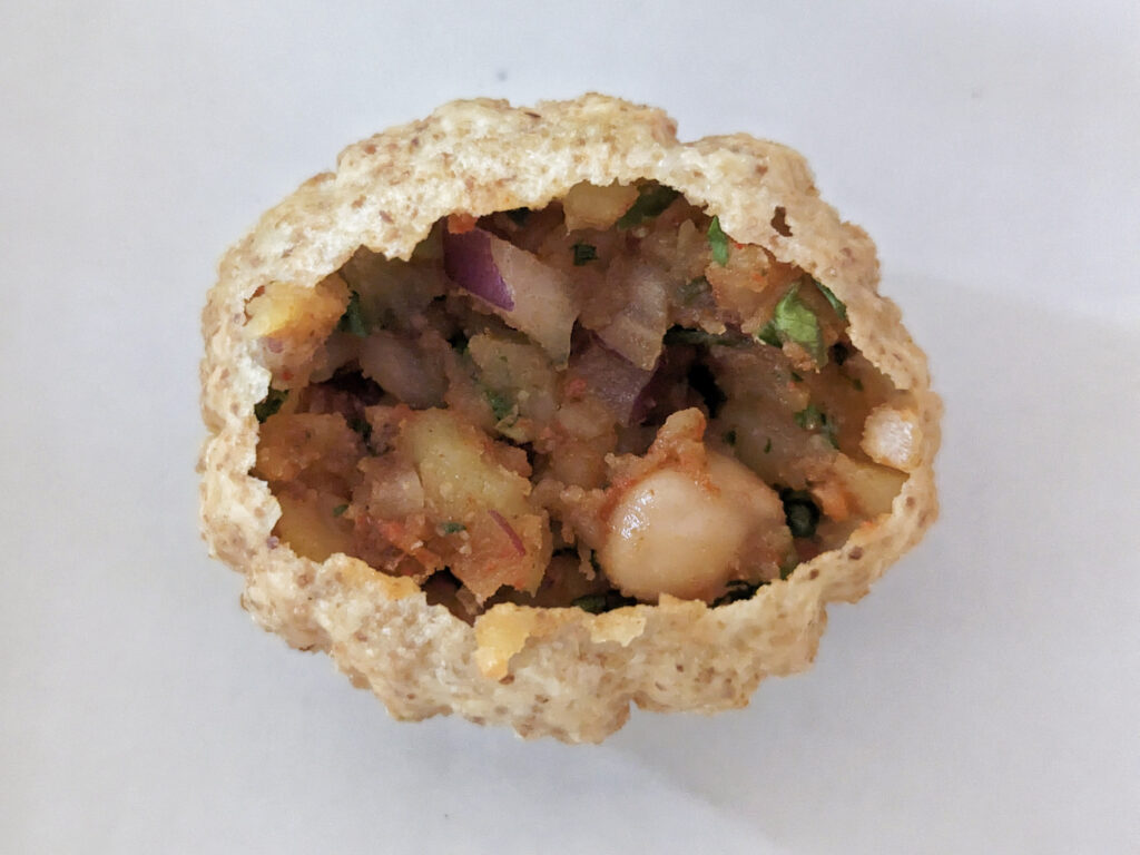 Filling added to the bottom of a puri.
