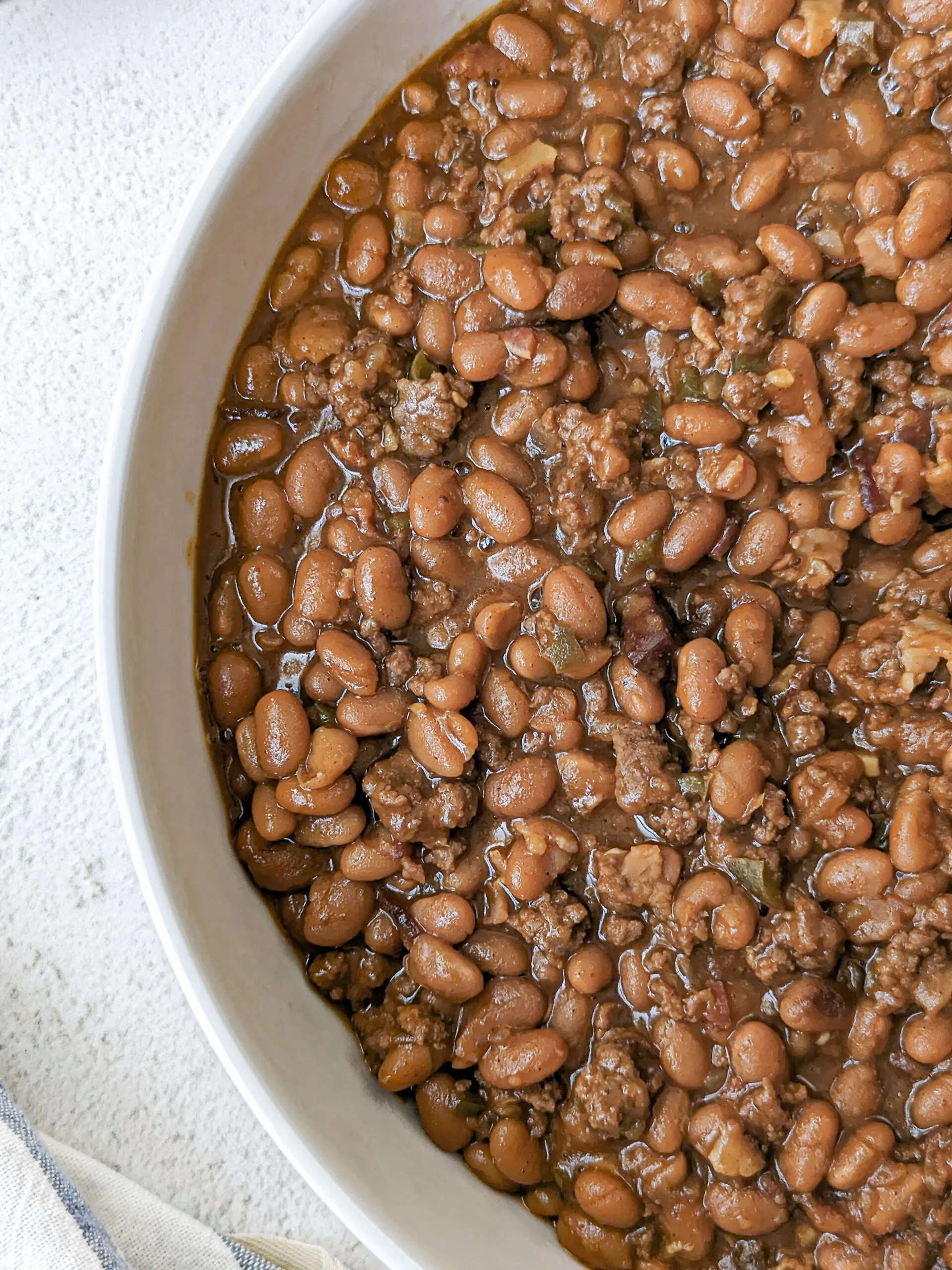 Baked beans in a serving bowl.