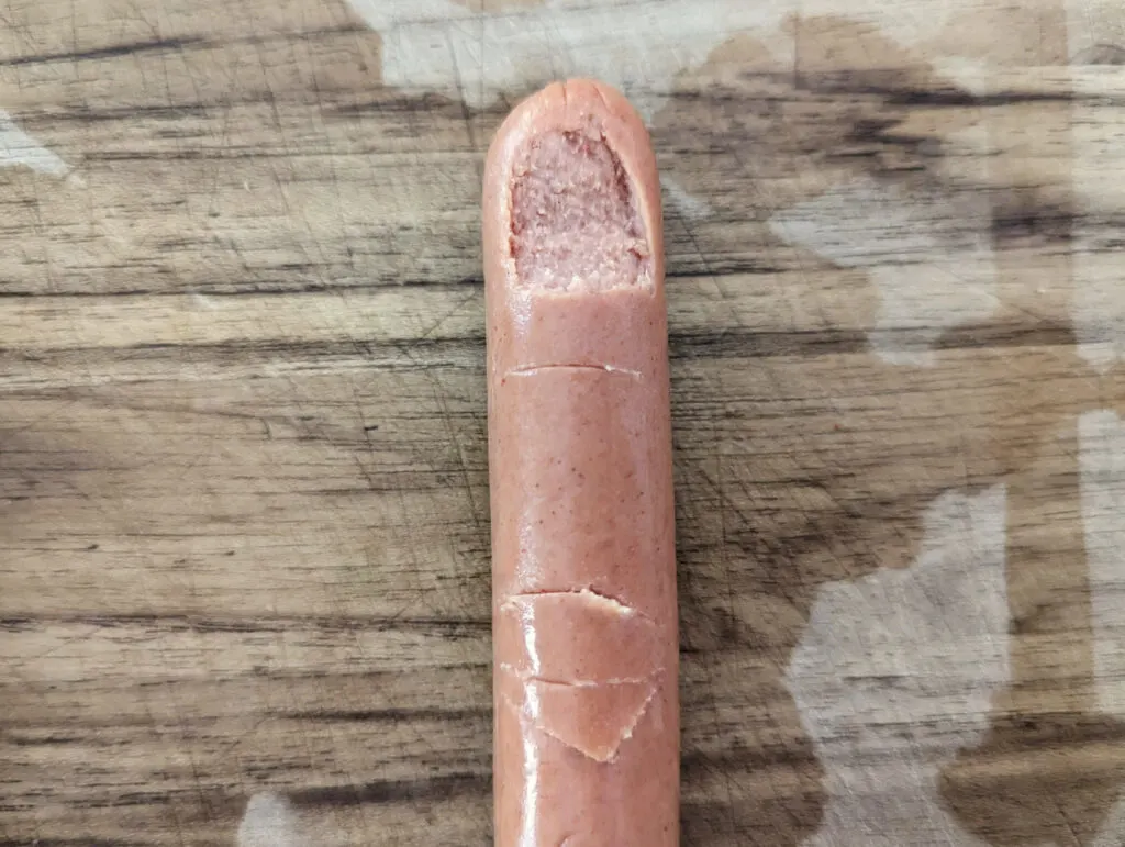 Knuckles etched into a hotdog.