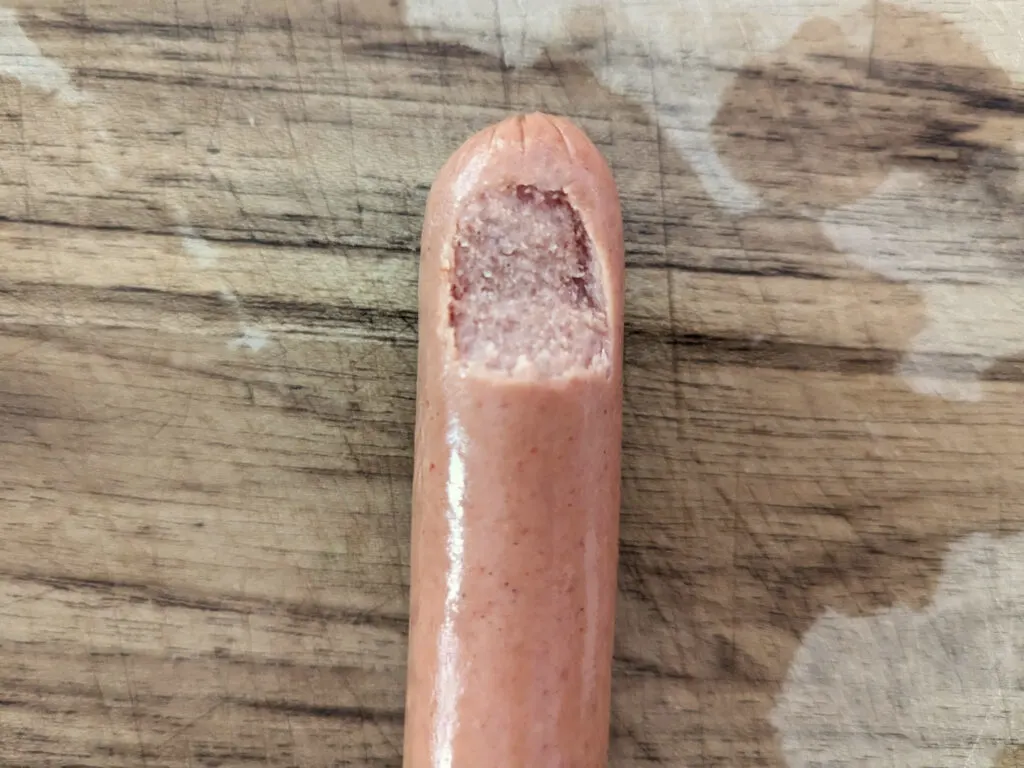 A fingernail etched into a hotdog.
