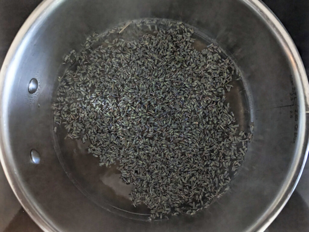 Lavender buds in a sauce pan.