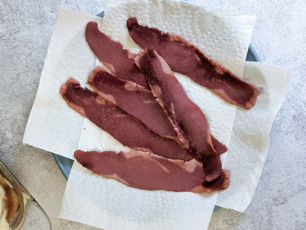 Turkey bacon drying on paper towels.