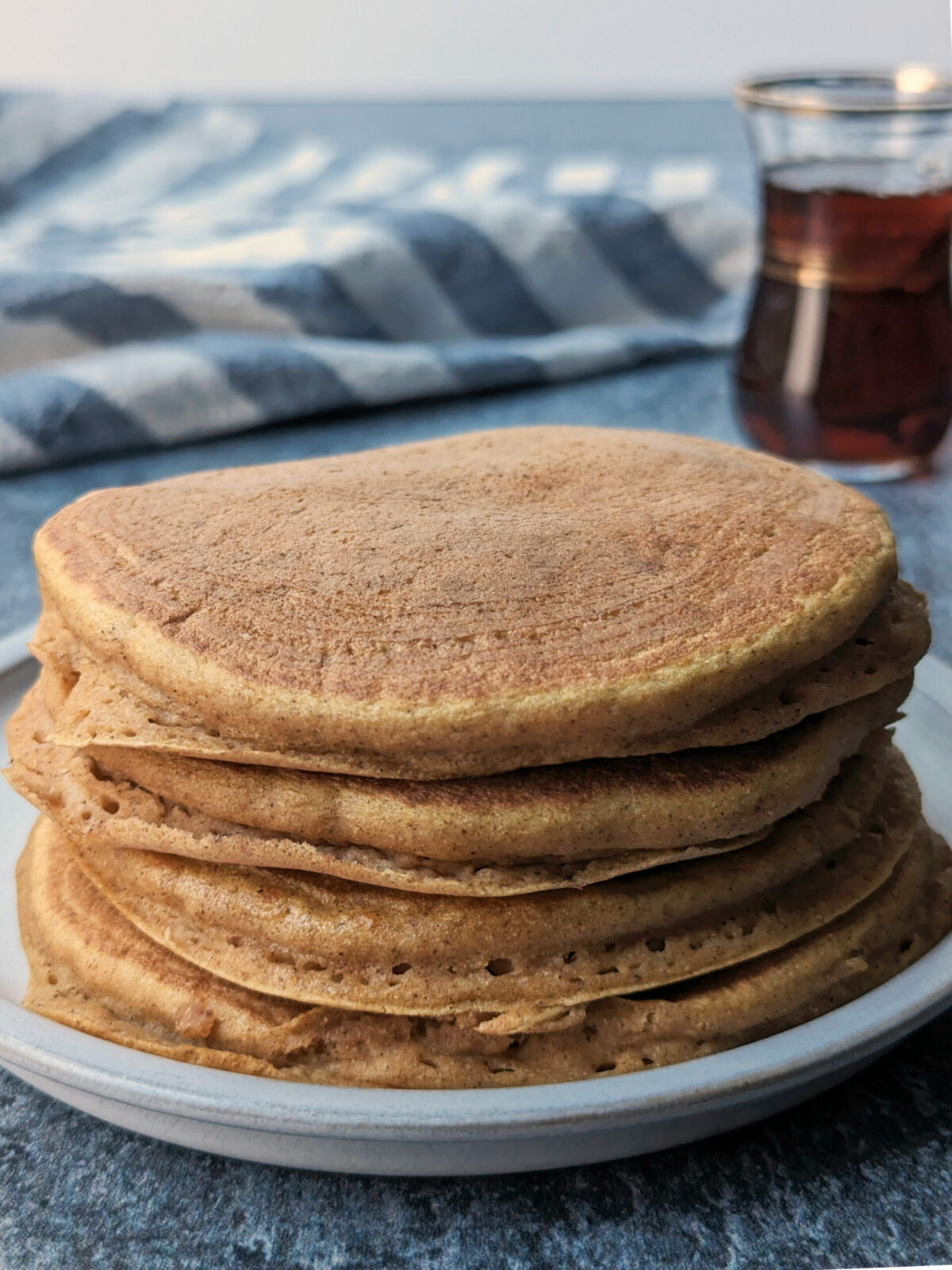 A stack of the Kodiak pumpkin pancakes on a plate.