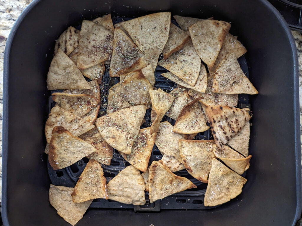 Za'atar sprinkled over the air fryer pita chips.
