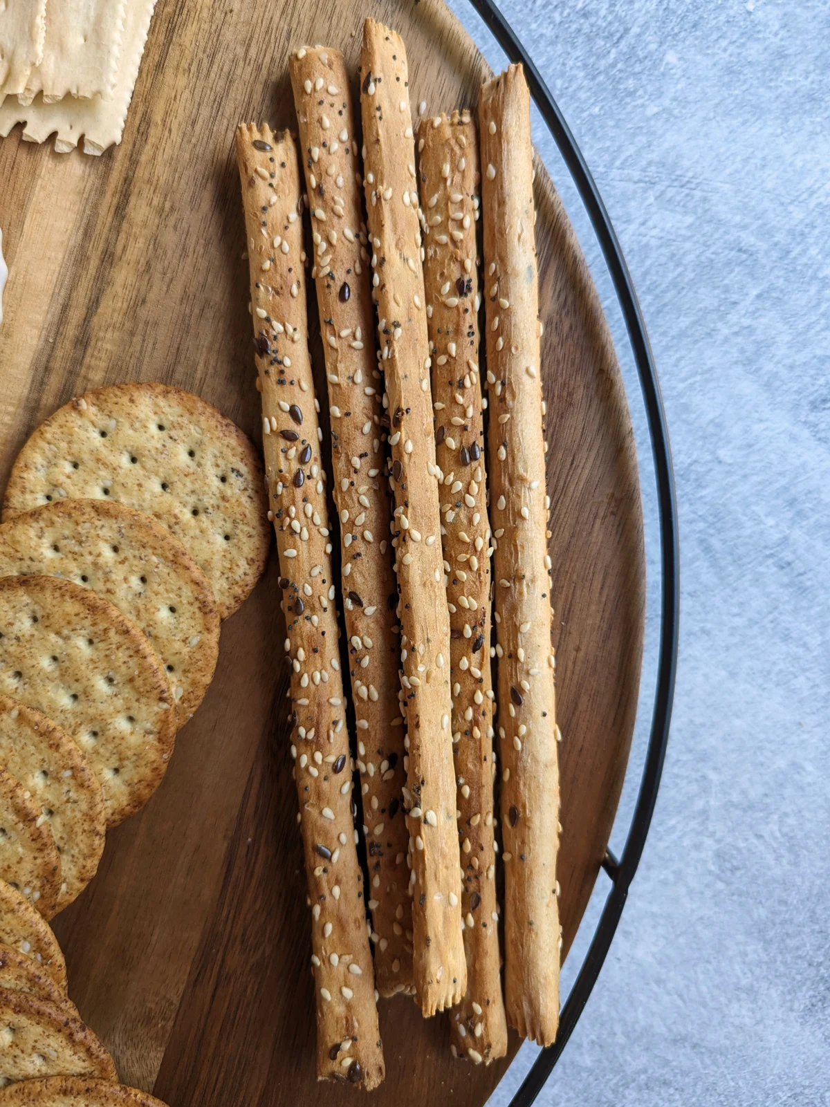 Breadstick crackers on a charcuterie board