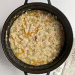 A dutch oven of orzo substitute soup.