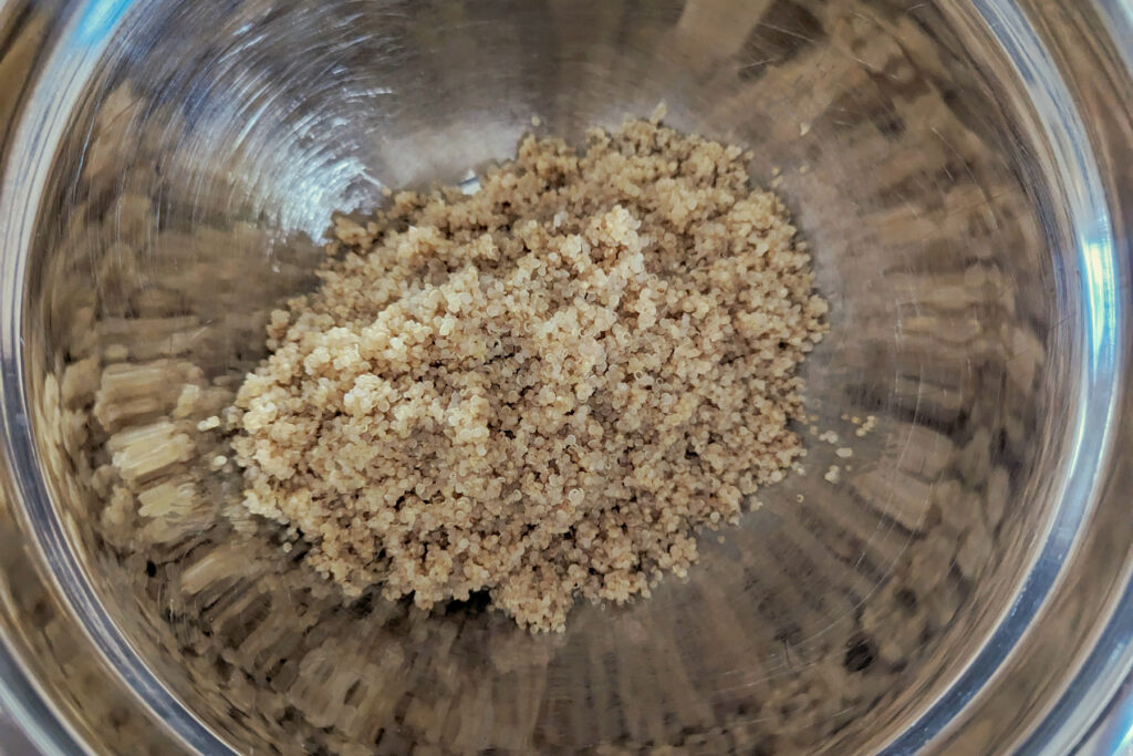 Cooked quinoa in a mixing bowl.