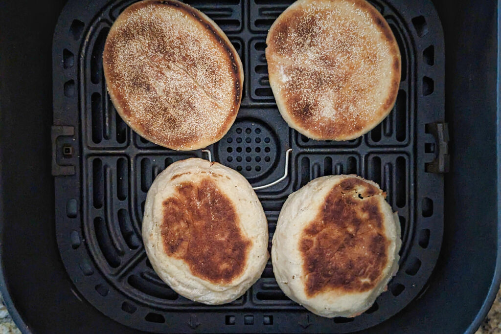 Line english muffins in the air fryer basket. 