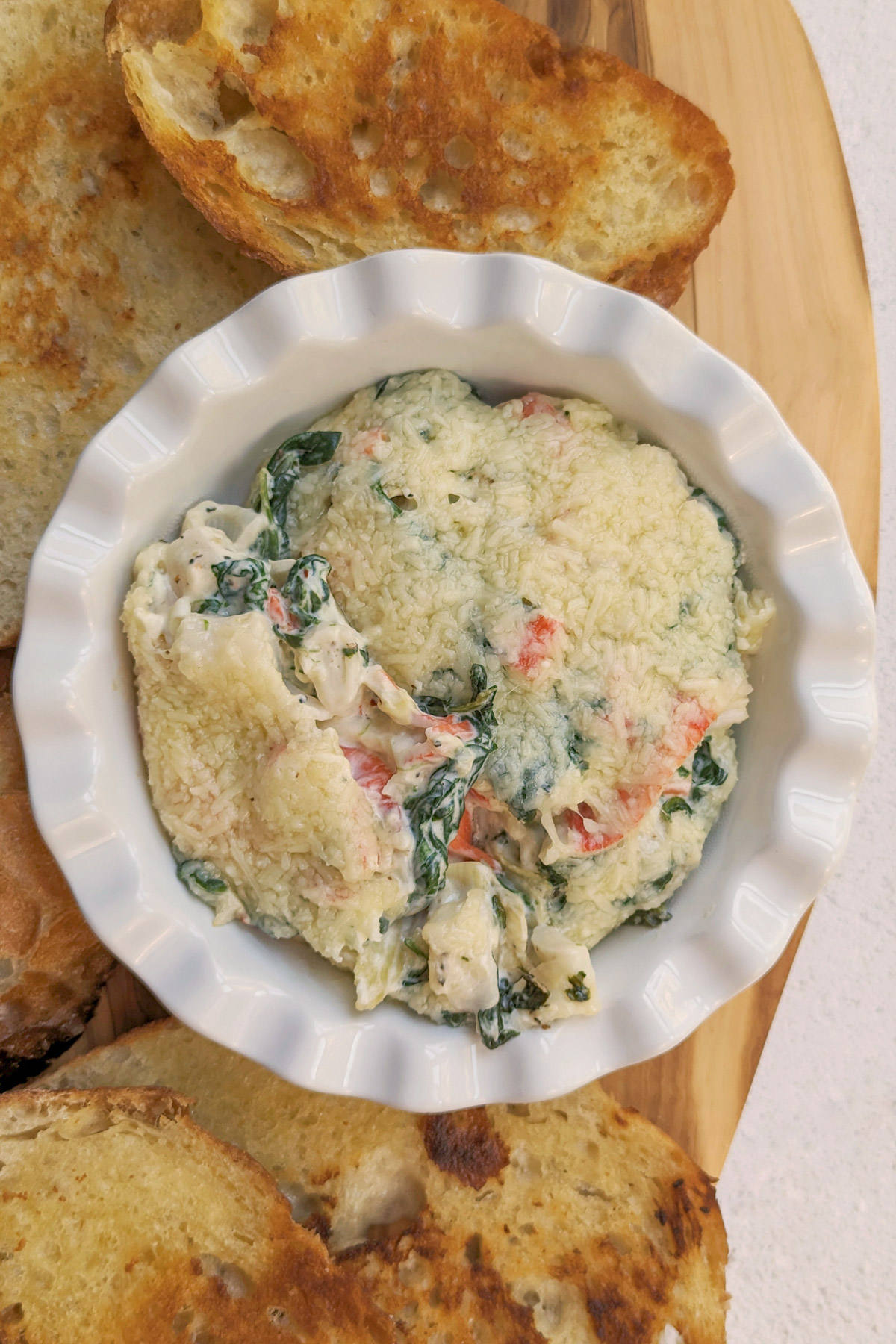 Crab spinach dip with bread.