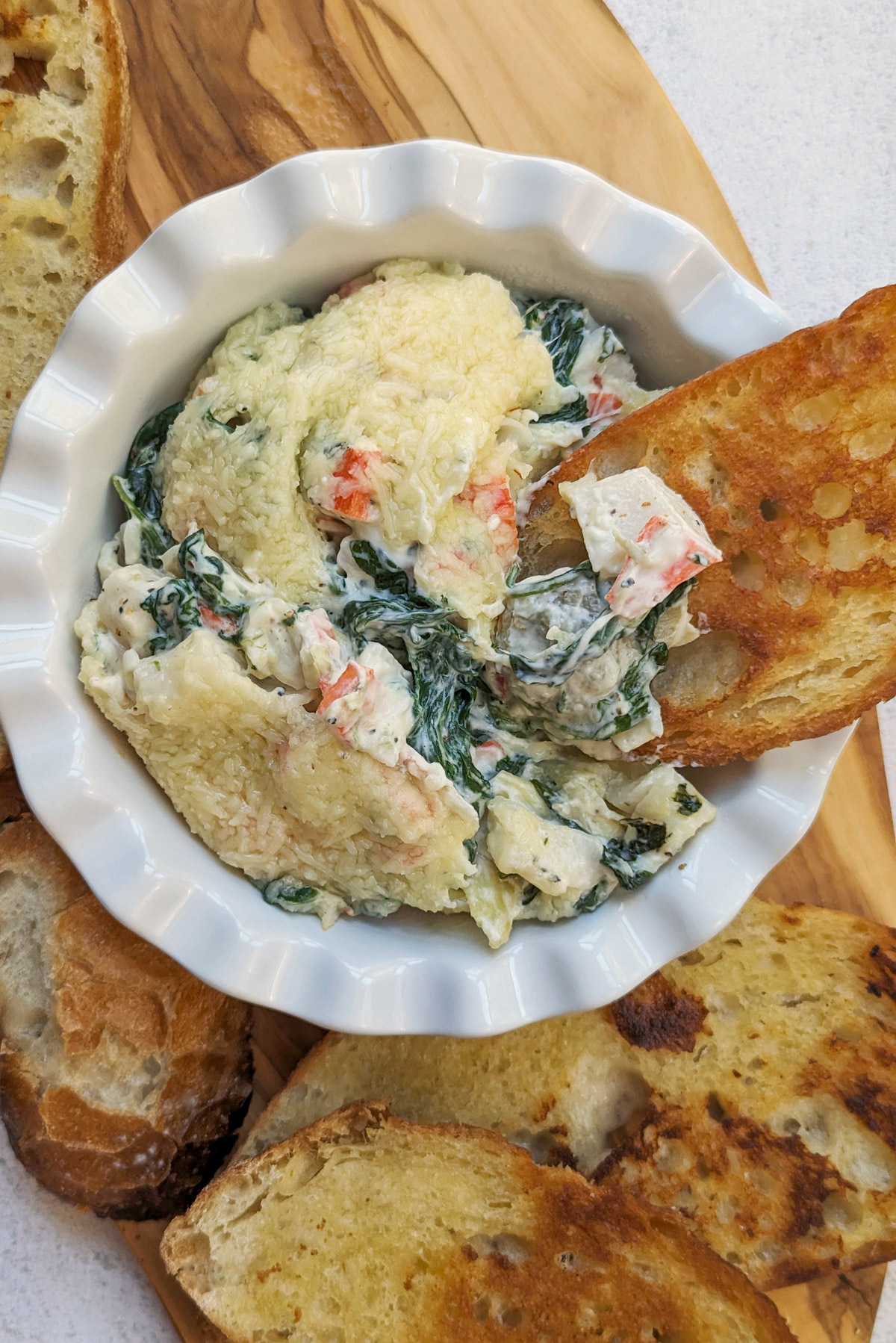 Crab spinach dip with bread. 