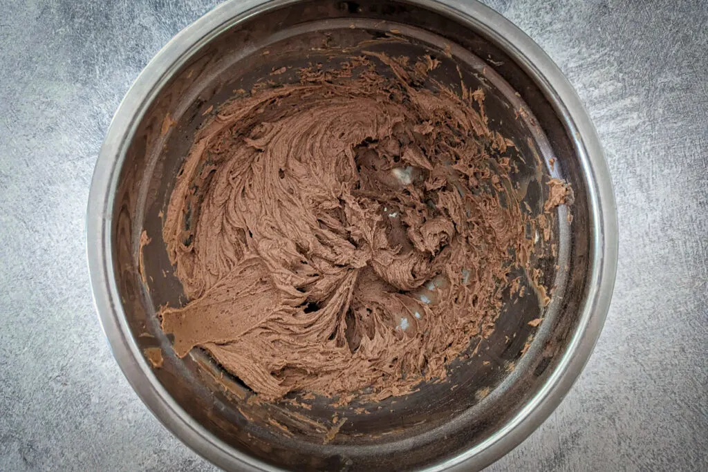Powdered sugar, cocoa powder, espresso, and other ingredients added to the bowl.