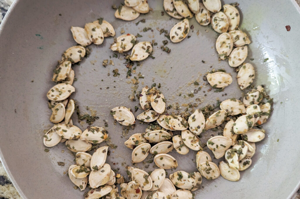 Pumpkin seeds tossed with oil and seasoning.