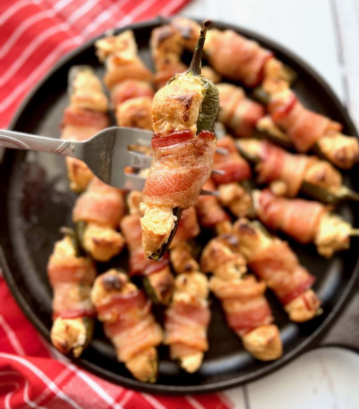 Smoked jalapeno poppers on a plate.