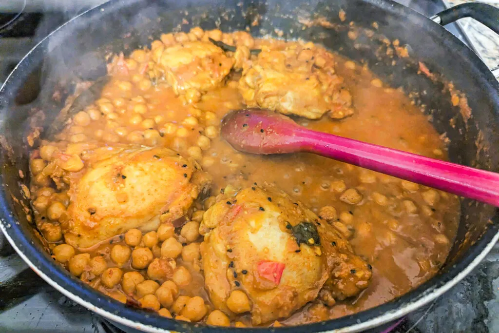 Chana chicken cooking in a pot.