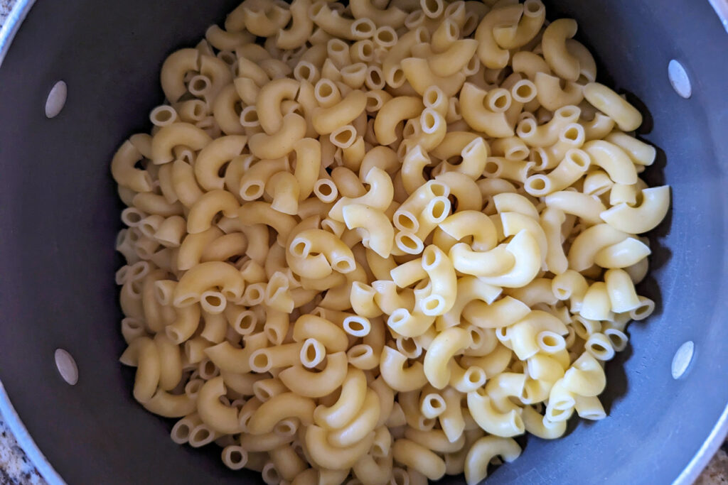 Cooked noodles in a pan.