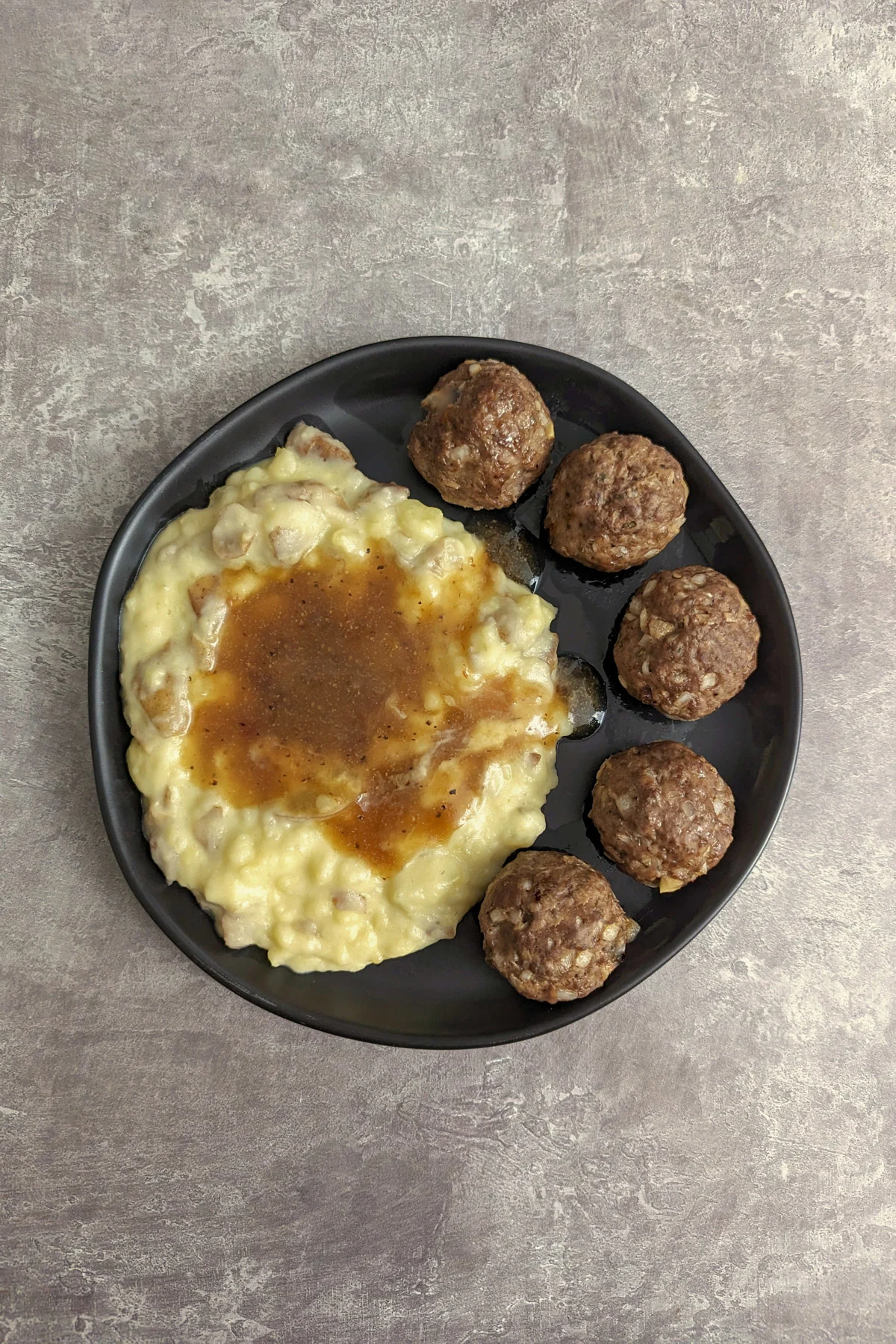 Elk meatballs with mashed potatoes and gravy.