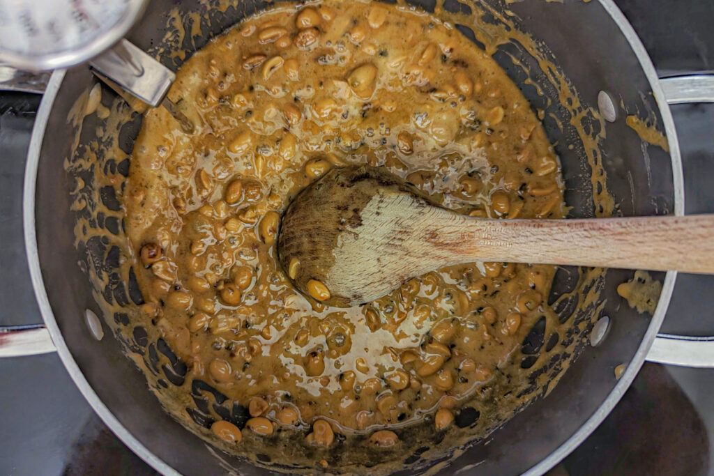 Melted peanut brittle mixture in the saucepan. 