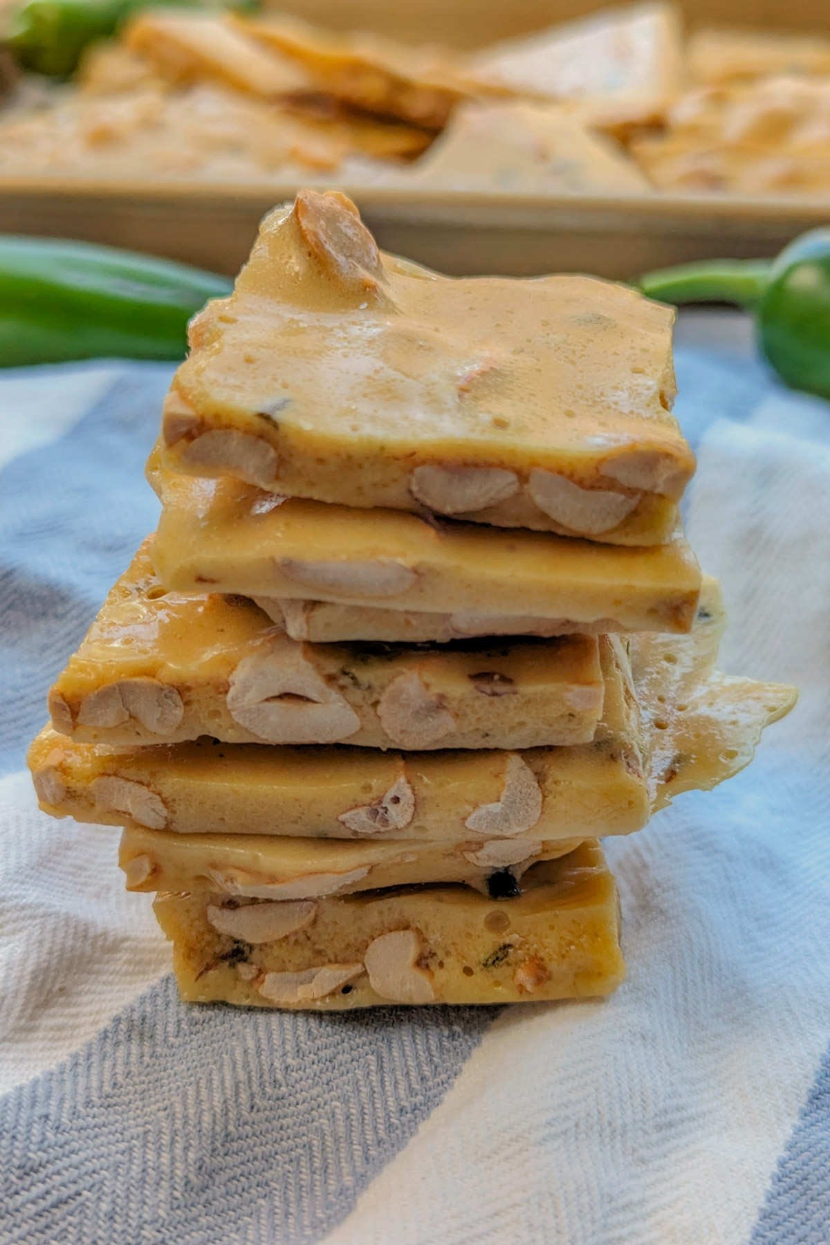 Jalapeno Peanut Brittle stacked on each other.