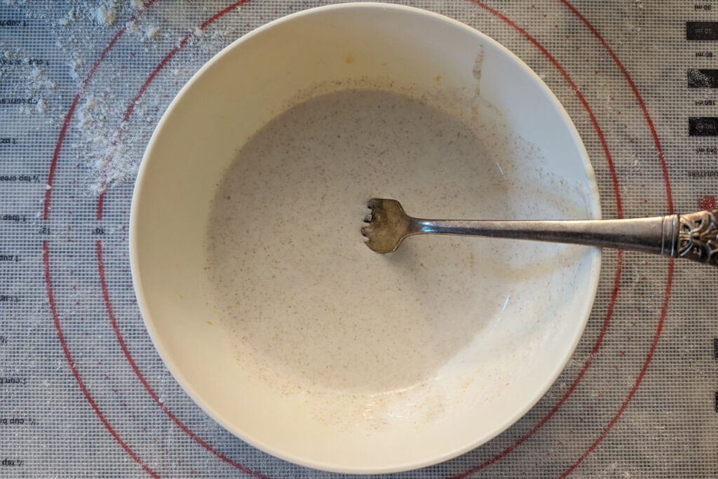 Sourdough discard and heavy cream in a bowl.