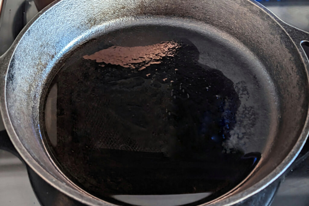 Oil in a cast iron pan.