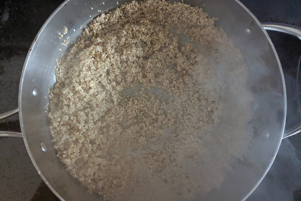 Quinoa cooking in a pan.