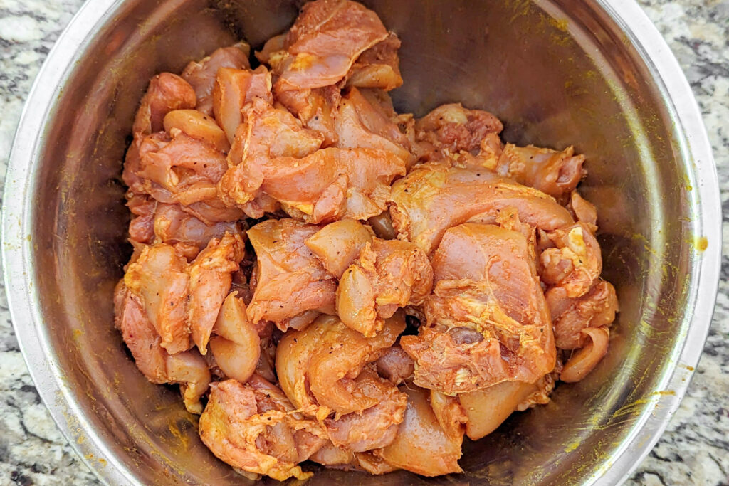 Chicken Marinating in a bowl.