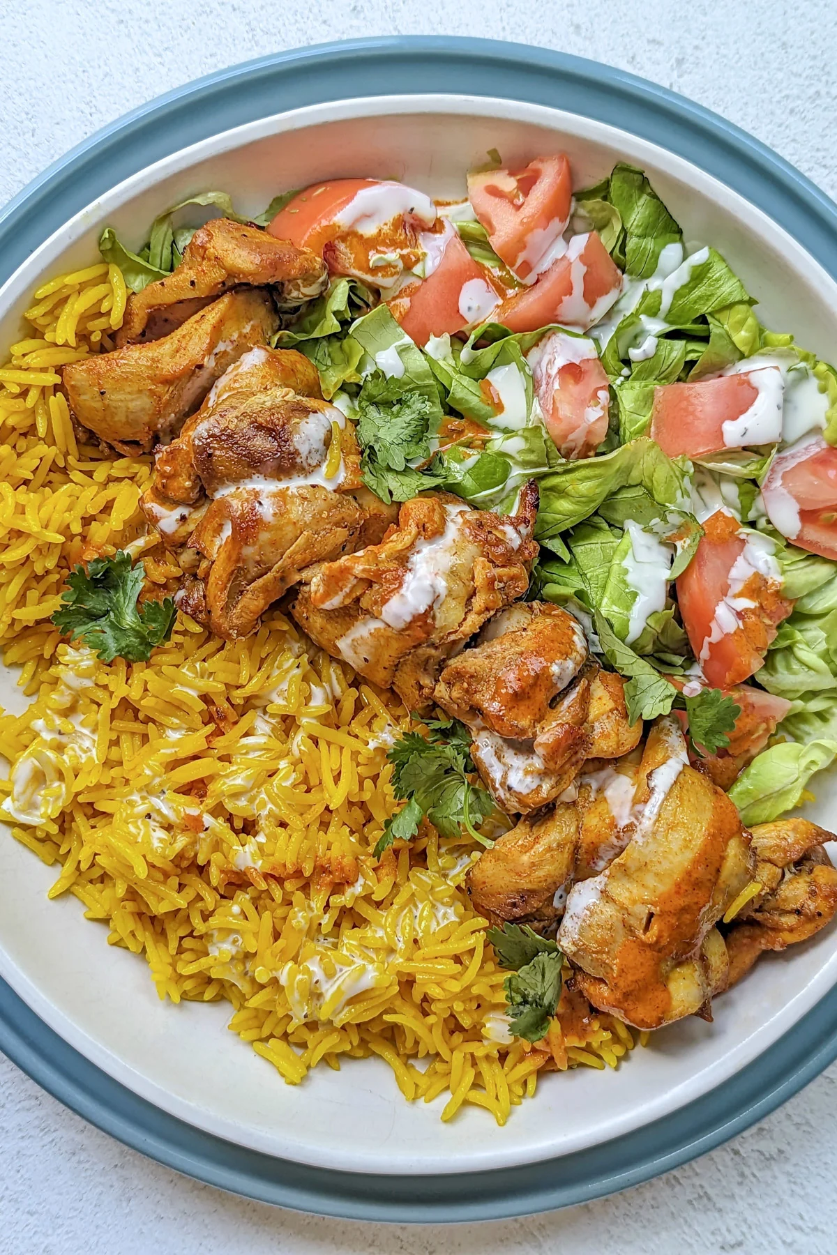 Halal chicken ove rice and a salad.