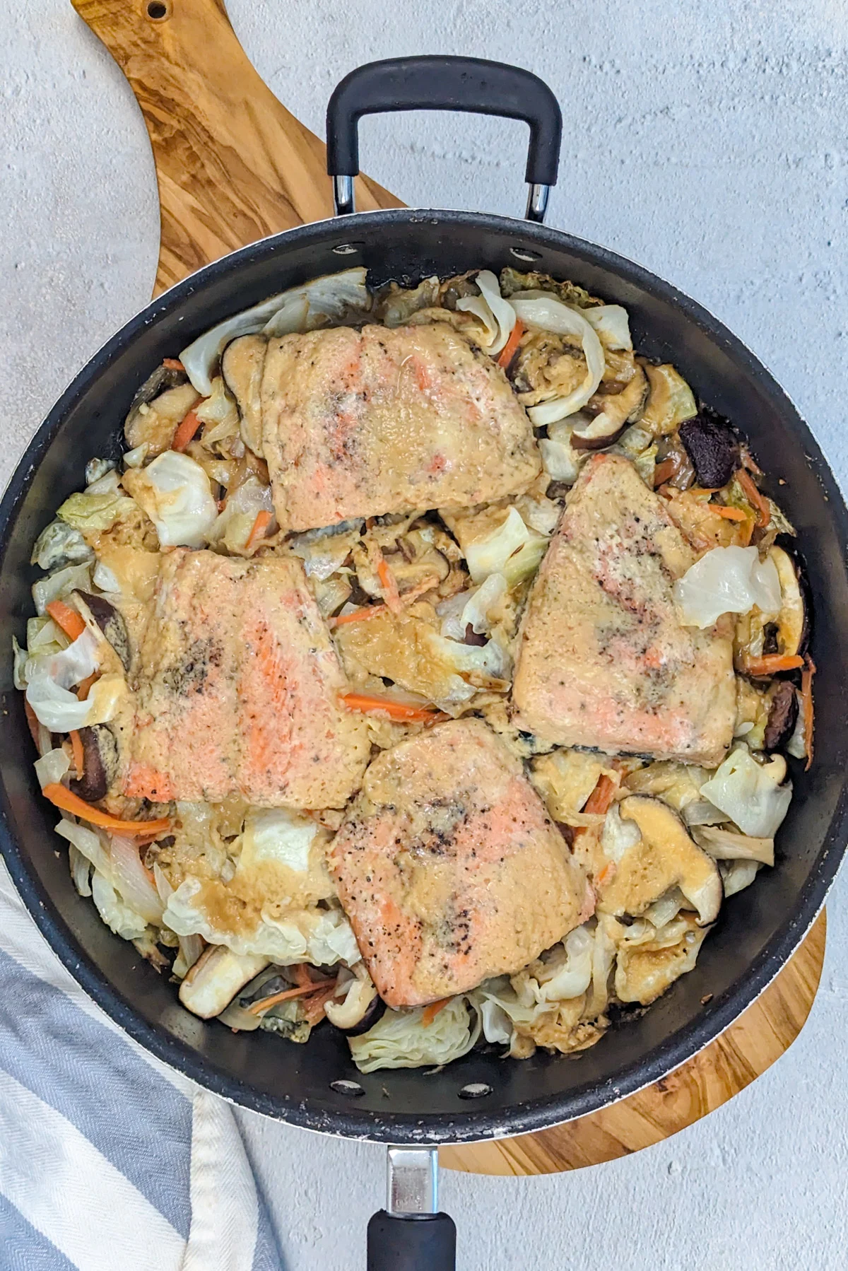 Miso butter salmon in a pan.
