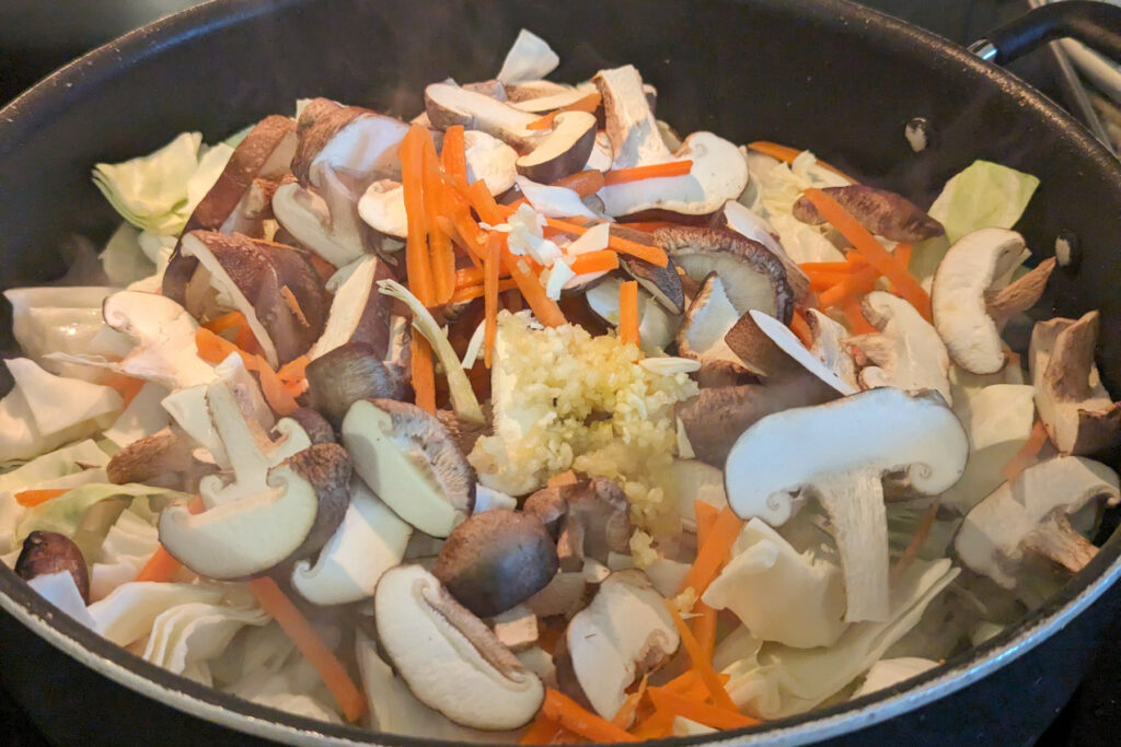 Vegetables cooking in a pan.