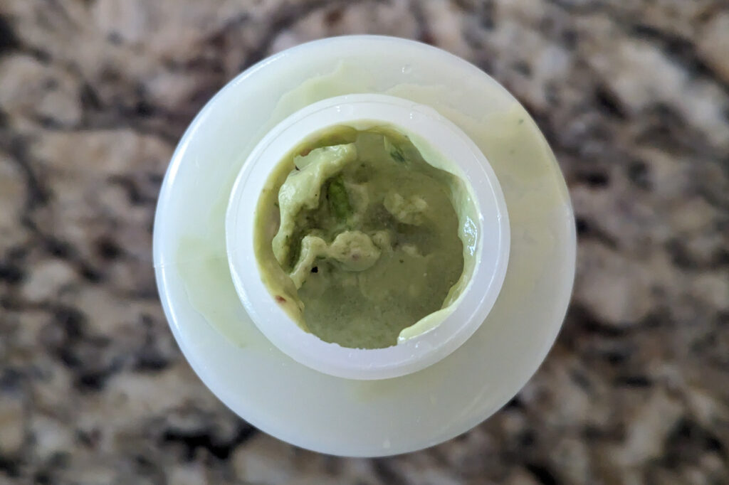 Avocado Lime Crema in a squeeze bottle.