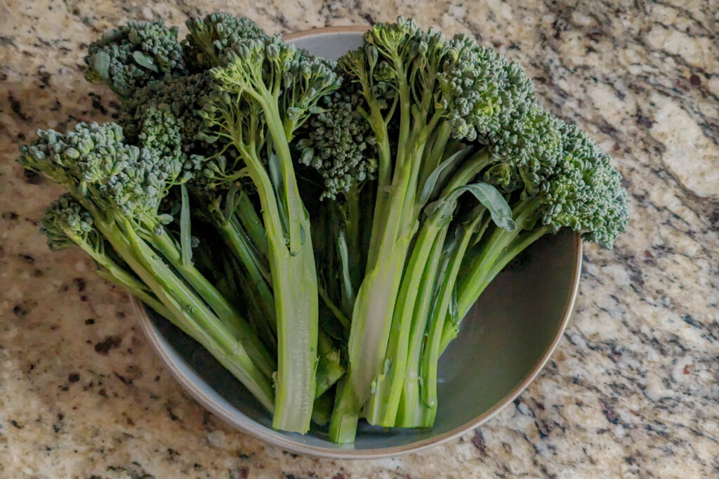 Cut broccoletti in a bowl.