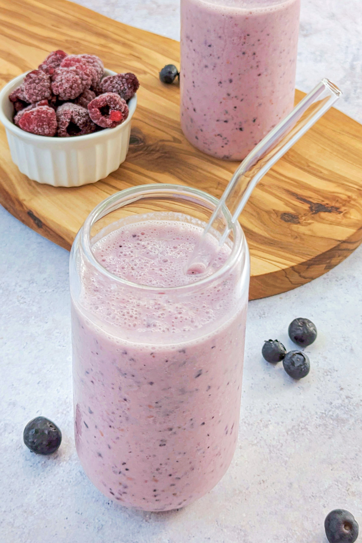 Raspberry Blueberry Smoothie in a drinking glass. 