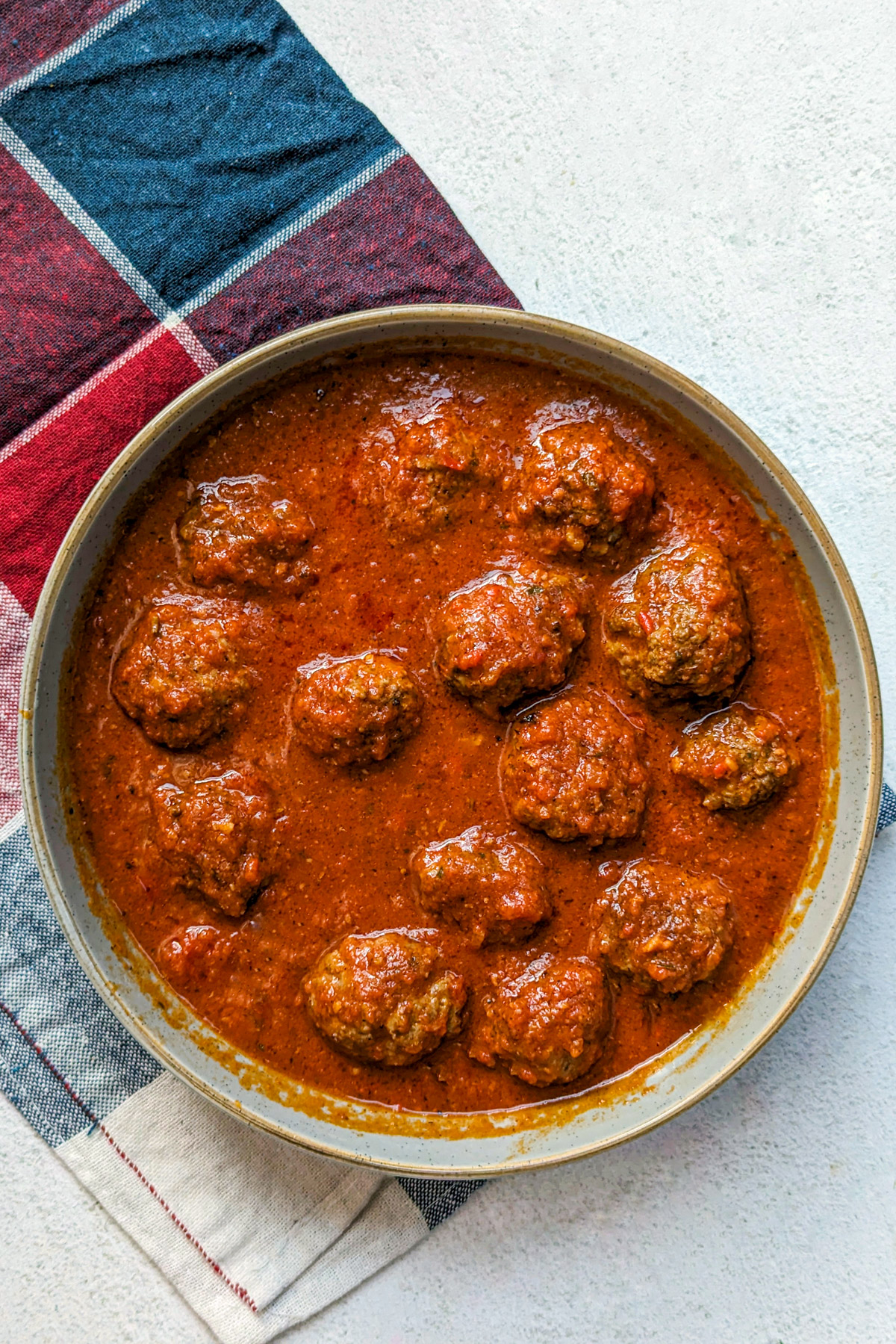 A serving bowl with Dutch oven meatballs.