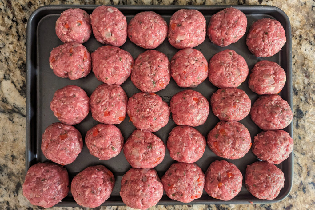 Ground beef rolled into meatballs.