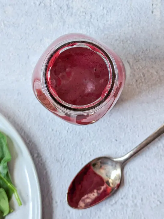 Blackberry vinaigrette in a serving container.