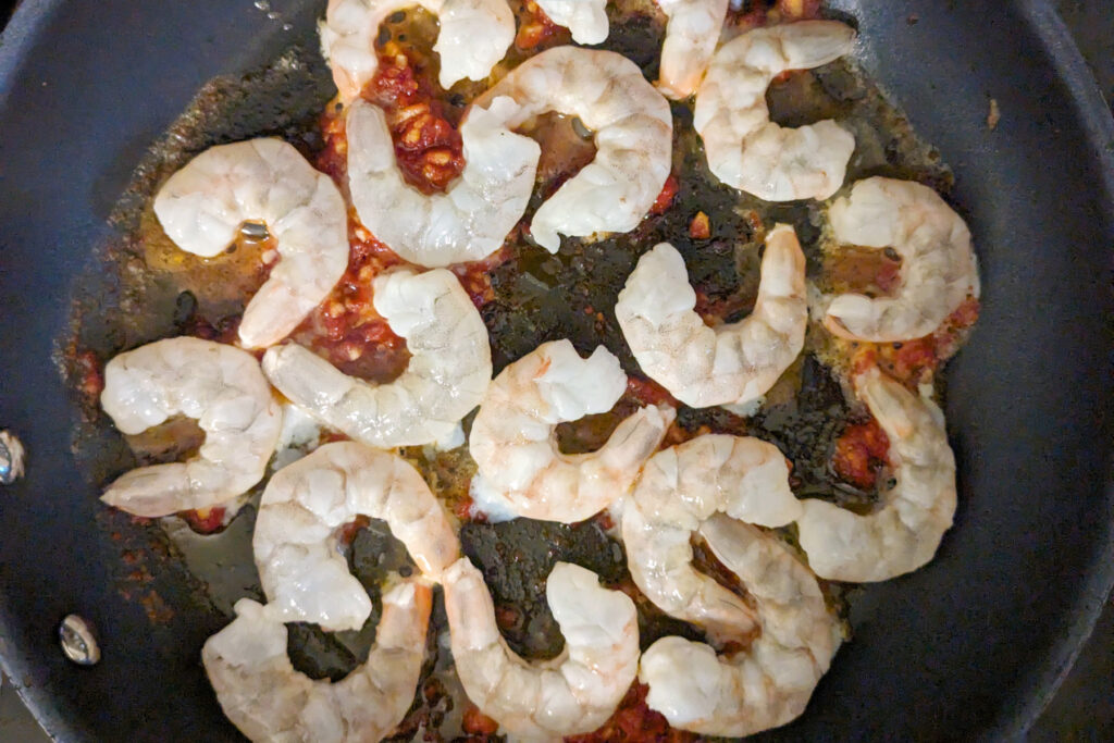 Shrimp searing in a pan.