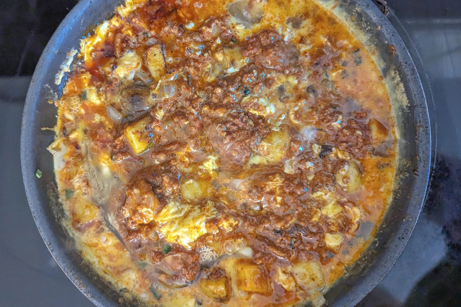 Chorizo cooking with the potatoes and eggs.