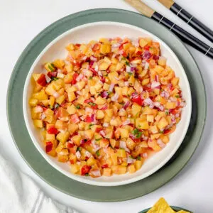 Peach habanero salsa in a serving bowl.