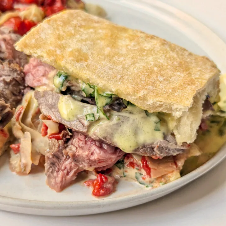 Chimichurri steak sandwich on a plate.